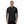 Load image into Gallery viewer, A young man is wearing a black polo shirt featuring an original “Love” design by Christian Polo Shirt Designers - Loves Everywhere.
