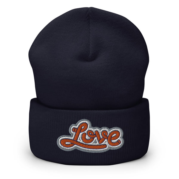 A men’s navy blue beanie features a professionally embroidered, original “Love” design by Christian Clothing Brand - Loves Everywhere