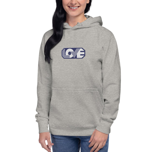 A woman is wearing a grey hoodie featuring an original “Love” design print by Christian Apparel Line - Loves Everywhere