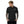 Load image into Gallery viewer, A young man is wearing a black polo shirt featuring an original “Love” design by Christian Polo Shirt Designers - Loves Everywhere.
