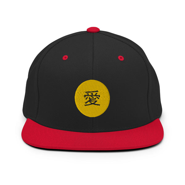 A black and red snapback hat features an embroidered and original “Love” design by Christian Apparel Company - Loves Everywhere