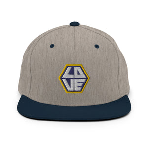 A heather gray and navy blue snapback hat features an embroidered and original “Love” design by Christian Hat Company - Loves Everywhere