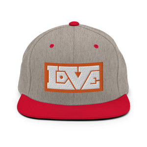 A heather grey and red snapback hat features an embroidered and original “Love” design by Christian Hat Company - Loves Everywhere