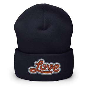 A men’s navy blue beanie features a professionally embroidered, original “Love” design by Christian Clothing Brand - Loves Everywhere 