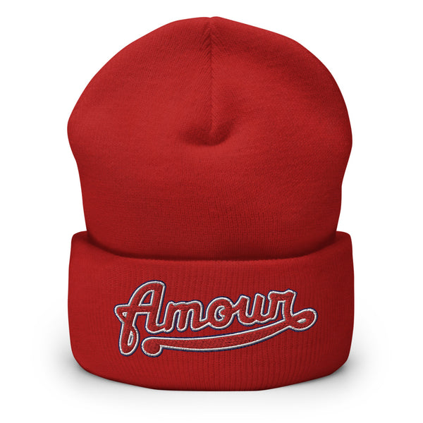 A women’s cuffed red beanie features a professionally embroidered, original “Amour” design by Christian Hat Company - Loves Everywhere