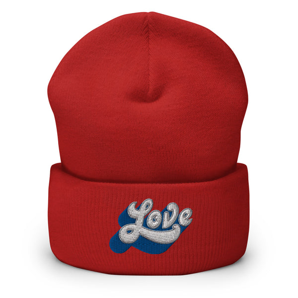 A men’s red beanie features a professionally embroidered, original “Love” design by Christian Clothing Brand - Loves Everywhere 