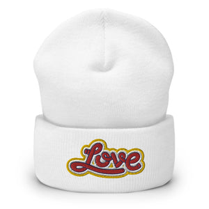 A women’s cuffed white beanie features a professionally embroidered, original “Love” design by Christian Hat Company - Loves Everywhere