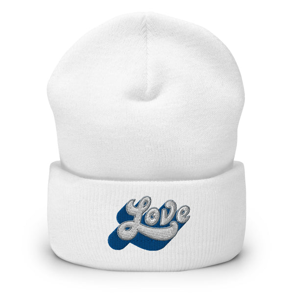 A women’s cuffed, white beanie features a professionally embroidered, original “Love” design by Christian Hat Company - Loves Everywhere