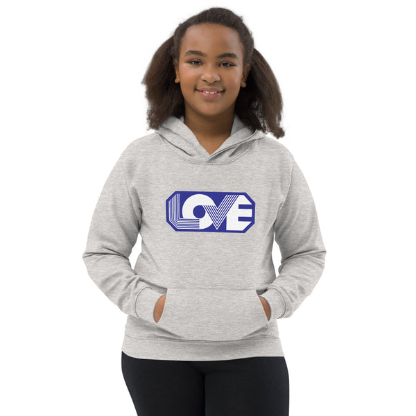 A girl is wearing a printed Hoodie featuring an original “Love” design on a light heather grey hoodie by Christian Clothing Company, Loves Everywhere