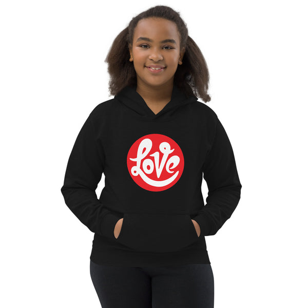 A girl is wearing a printed Hoodie featuring an original “Love” design on a black hoodie by Christian Clothing Company, Loves Everywhere