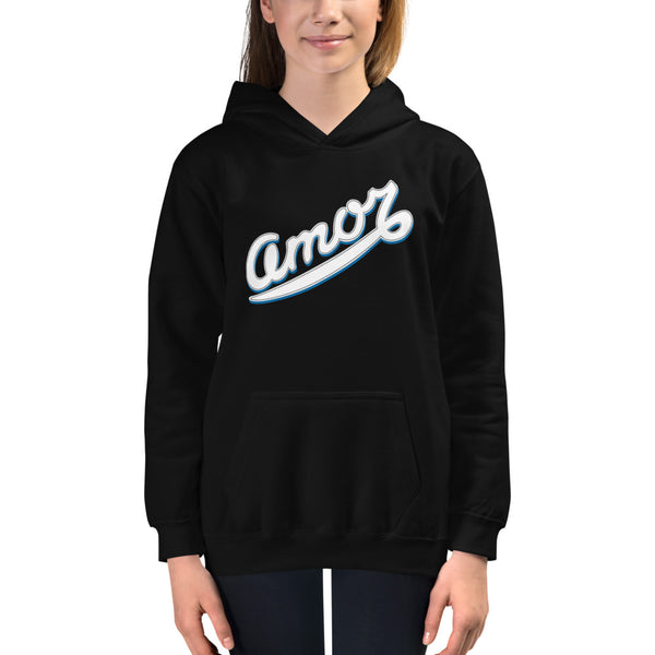 A girl is wearing a printed Hoodie featuring an original “Amor” design on a black hoodie by Christian Clothing Brand, Loves Everywhere