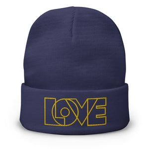 A men’s navy blue beanie features a professionally embroidered, original “Love” design by Christian Clothing Brand - Loves Everywhere