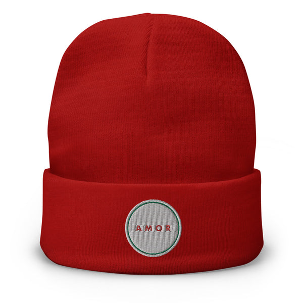 A woman’s knit, red beanie features a professionally embroidered, original “Amor” design by Christian Hat Company - Loves Everywhere