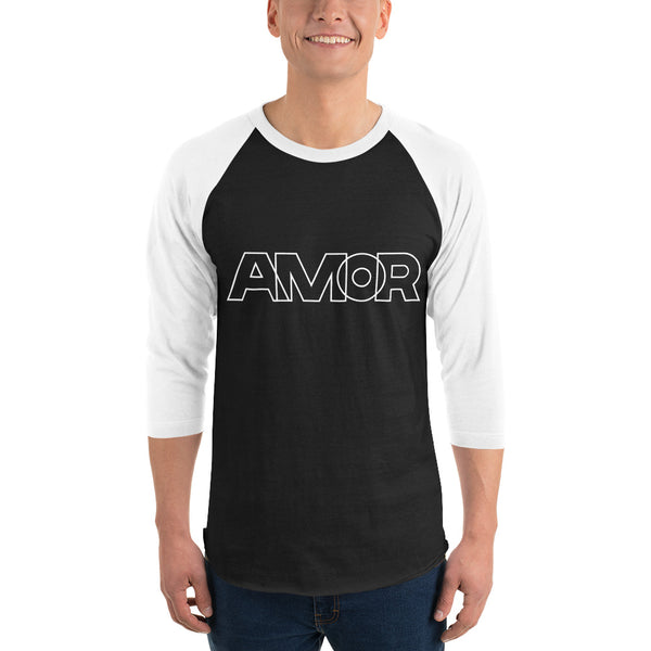 A man is wearing a black and white 3/4 Sleeve Raglan Shirt featuring an original “Love” design print by Christian Shirt Company - Loves Everywhere