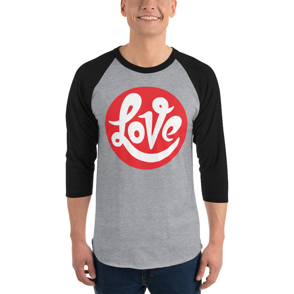 A man is wearing a black and grey 3/4 Sleeve Raglan Shirt featuring an original “Love” design print by Christian Shirt Company - Loves Everywhere