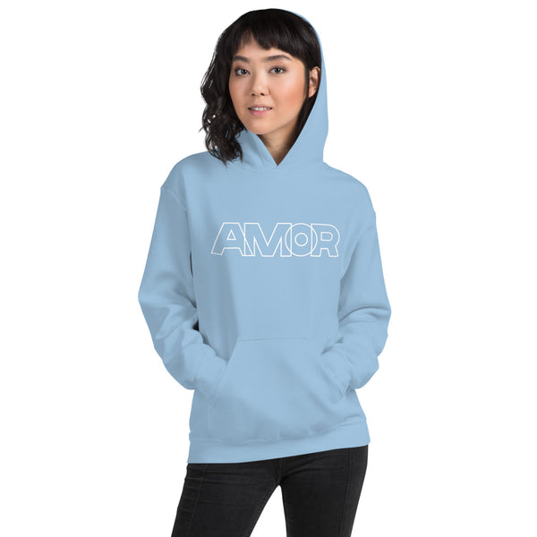 A woman is wearing a light blue hoodie featuring an original “Amor” design print by Christian Apparel Line - Loves Everywhere