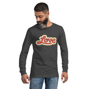 A man is wearing a dark heather grey Long Sleeve T-shirt featuring an original “Love” design print by Christian Shirt Company - Loves Everywhere