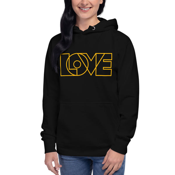 A woman is wearing a black hoodie featuring an original “Love” design print by Christian Apparel Line - Loves Everywhere