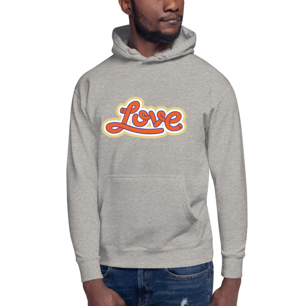 A man is wearing a Heather Grey Hoodie featuring an original “Love” design print by Christian Clothing Brand - Loves Everywhere