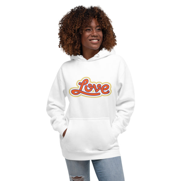 A woman is wearing a white hoodie featuring an original “Love” design print by Christian Apparel Line - Loves Everywhere