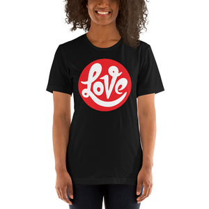 A young woman is wearing a black Crew Neck T Shirt featuring an original “Love” design print by Christian T-Shirt Brand - Loves Everywhere