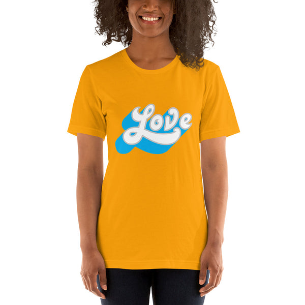 A young woman is wearing a gold Crew Neck T Shirt featuring an original “Love” design print by Christian Clothing Brand - Loves Everywhere