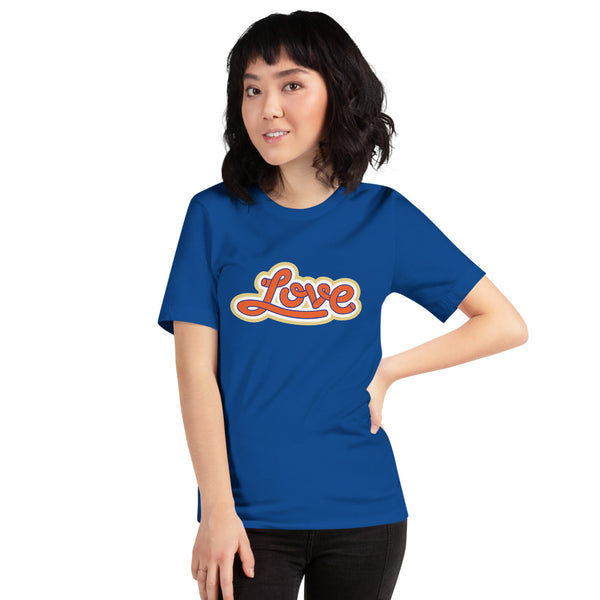 A young woman is wearing a Royal blue Crew Neck T Shirt featuring an original “Love” design print by Christian Apparel Brand - Loves Everywhere