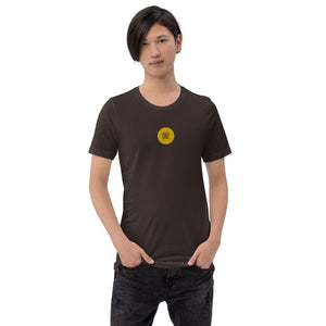 A man is wearing a dark brown Short Sleeve T-shirt featuring an embroidered, original “Love” design by Christian Shirt Company - Loves Everywhere