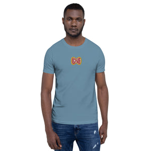 A man is wearing a steel blue Short Sleeve T-shirt featuring an embroidered, original “Love” design by Christian Shirt Company - Loves Everywhere