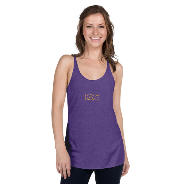 A woman is wearing a purple Racerback Tank Top featuring an original “Love” design print by Christian Apparel Brand - Loves Everywhere