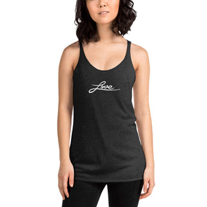 A woman is wearing a black Racerback Tank Top featuring an original “Love” design print by Christian Apparel Brand - Loves Everywhere