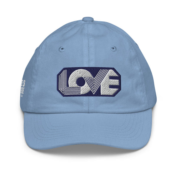 A boy’s light blue baseball cap featuring an original “Love” design by Christian Hat Company, Loves Everywhere