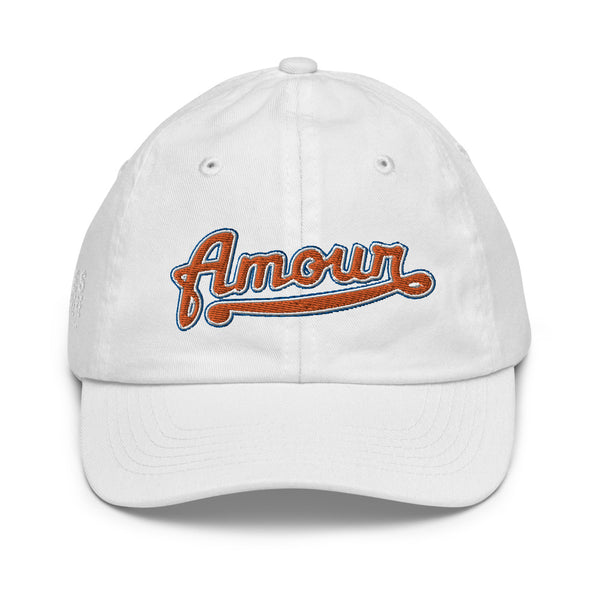 A boy’s white baseball cap featuring an original “Amour” design by Christian Hat Company, Loves Everywhere