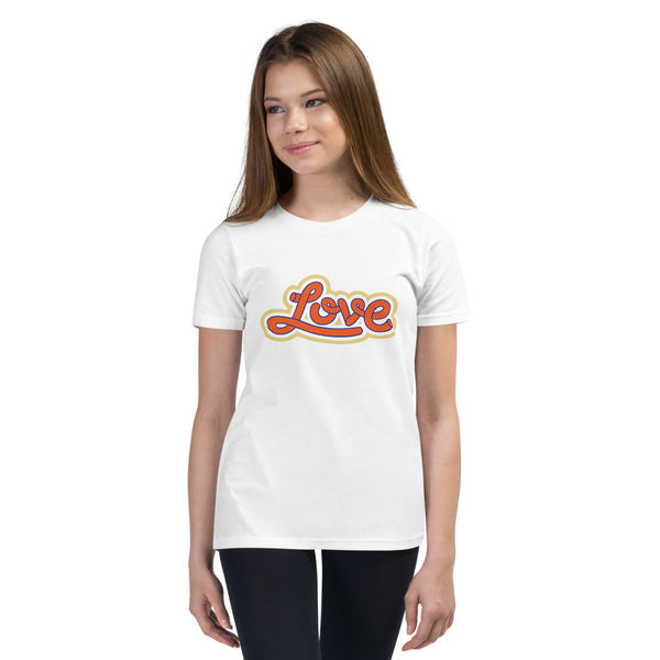 A girl is wearing a printed Christian T Shirt featuring an original “Love” design on a white shirt by Christian Clothing Company, Loves Everywhere